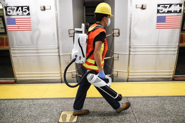 A contractor carries an electrostatic sprayer used to disinfect subway cars at the 96th Street station to control the spread of COVID-19, Thursday, July 2, 2020, in New York. (AP) A contractor carries an electrostatic sprayer used to disinfect subway cars at the 96th Street station to control the spread of COVID-19, Thursday, July 2, 2020, in New York. (AP)