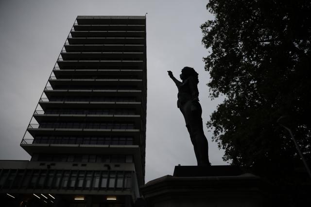 A new black resin and steel statue entitled "A Surge of Power (Jen Reid) 2020" by artist Marc Quinn stands after the statue was put up in the morning on the empty plinth of the toppled statue of 17th century slave trader Edward Colston. (AP) A new black resin and steel statue entitled "A Surge of Power (Jen Reid) 2020" by artist Marc Quinn stands after the statue was put up in the morning on the empty plinth of the toppled statue of 17th century slave trader Edward Colston. (AP)
