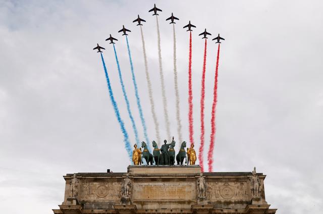 Alpha jets from the French Air Force Patrouille de France fly past the Arc de Triomphe du Carrousel, next to Le Louvre museum, during the Bastille Day celebrations in Paris, France, July 14, 2020. (REUTERS) Alpha jets from the French Air Force Patrouille de France fly past the Arc de Triomphe du Carrousel, next to Le Louvre museum, during the Bastille Day celebrations in Paris, France, July 14, 2020. (REUTERS)