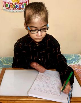 Bhavarth Aggarwal completed the exam using his left hand in the allotted three hours. (HT Photo ) Bhavarth Aggarwal completed the exam using his left hand in the allotted three hours. (HT Photo )
