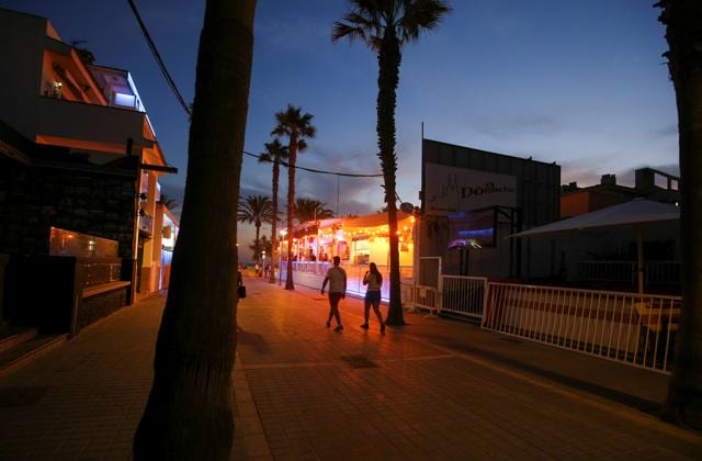 People walk in the Bierstrasse street (Miquel Pellisa street) in El Arenal beach in Palma de Mallorca, Spain, July 15, 2020. (REUTERS) People walk in the Bierstrasse street (Miquel Pellisa street) in El Arenal beach in Palma de Mallorca, Spain, July 15, 2020. (REUTERS)