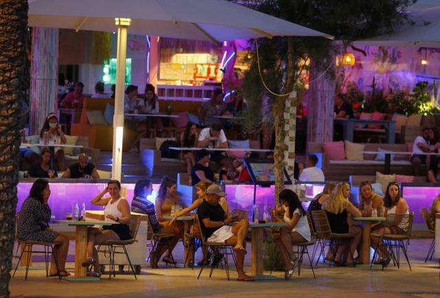 Open touristic bars are seen in the corner of Bierstrasse street (Miquel Pellisa street) in El Arenal beach, in Palma de Mallorca, Spain, July 15, 2020. (REUTERS) Open touristic bars are seen in the corner of Bierstrasse street (Miquel Pellisa street) in El Arenal beach, in Palma de Mallorca, Spain, July 15, 2020. (REUTERS)