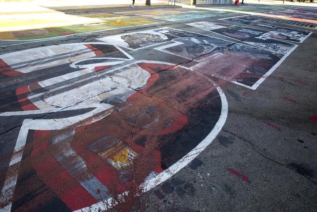Red paint marred Black Lives Matter mural in front of City Hall, Wednesday, July 15, 2020, in Cincinnati, Police in Cincinnati are asking the public for help in identifying the man who poured red paint on the block-long mural in front of city hall. The mural was officially dedicated June 19 amid protests across the nation against racial injustice and police brutality following the May 25 police killing of George Floyd in Minneapolis. It was created by teams of dozens of Black artists. (AP) Red paint marred Black Lives Matter mural in front of City Hall, Wednesday, July 15, 2020, in Cincinnati, Police in Cincinnati are asking the public for help in identifying the man who poured red paint on the block-long mural in front of city hall. The mural was officially dedicated June 19 amid protests across the nation against racial injustice and police brutality following the May 25 police killing of George Floyd in Minneapolis. It was created by teams of dozens of Black artists. (AP)