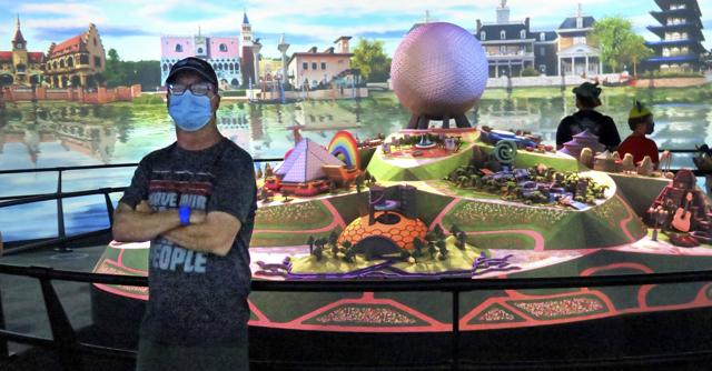 A guest watches The Epcot Experience 360-degree presentation during the official re-opening day of Epcot at Walt Disney World in Lake Buena Vista, Fla., Wednesday, July 15, 2020. (AP)