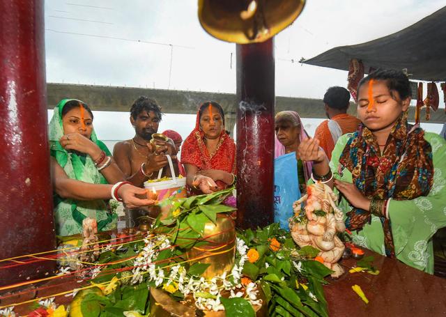 Patna: Hindu devotees offer prayers to Lord Shiva on the occasion of the third 'Somwar' of the holy month of 'Shravan', in Patna, Monday, July 20, 2020. (PTI) Patna: Hindu devotees offer prayers to Lord Shiva on the occasion of the third 'Somwar' of the holy month of 'Shravan', in Patna, Monday, July 20, 2020. (PTI)