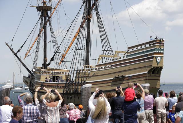 FILE - In this June 6, 2016 file photo, people on a wharf watch as the Mayflower II arrives in Plymouth Harbor in Plymouth, Mass. After undergoing more than three years of major renovations at Connecticut's Mystic Seaport and months of delays due to the COVID-19 pandemic, the replica of the Mayflower is is set to leave Mystic Seaport on Monday, July 20, 202 for a sea trials in New London, before sailing up the coast and arriving at Plimoth Plantation in Massachusetts on during the second week of August. (AP) FILE - In this June 6, 2016 file photo, people on a wharf watch as the Mayflower II arrives in Plymouth Harbor in Plymouth, Mass. After undergoing more than three years of major renovations at Connecticut's Mystic Seaport and months of delays due to the COVID-19 pandemic, the replica of the Mayflower is is set to leave Mystic Seaport on Monday, July 20, 202 for a sea trials in New London, before sailing up the coast and arriving at Plimoth Plantation in Massachusetts on during the second week of August. (AP)