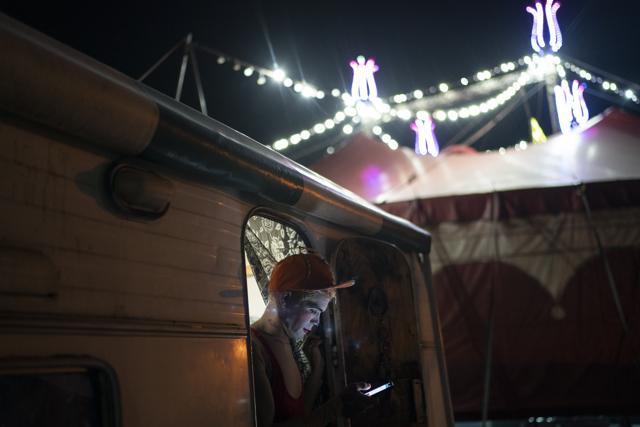 Edson Luan, the clown Pipoca, looks at his smartphone after sending a message to a colleague clown who got infected by COVID-19 before performing at the Estoril Circus amid the new coronavirus pandemic in Itaguai, greater Rio de Janeiro, Brazil, Saturday, July 18, 2020. (AP) Edson Luan, the clown Pipoca, looks at his smartphone after sending a message to a colleague clown who got infected by COVID-19 before performing at the Estoril Circus amid the new coronavirus pandemic in Itaguai, greater Rio de Janeiro, Brazil, Saturday, July 18, 2020. (AP)