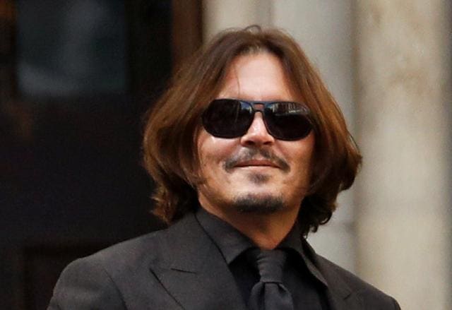 Actor Johnny Depp leaves the High Court in London, Britain July 22, 2020. (REUTERS) Actor Johnny Depp leaves the High Court in London, Britain July 22, 2020. (REUTERS)