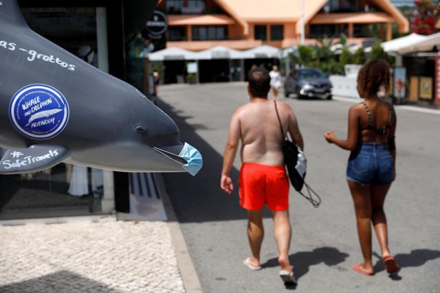 A prop doll displays dolphin-watching tours during the coronavirus disease (COVID-19) pandemic in Vilamoura, Portugal July 20, 2020. (REUTERS) A prop doll displays dolphin-watching tours during the coronavirus disease (COVID-19) pandemic in Vilamoura, Portugal July 20, 2020. (REUTERS)