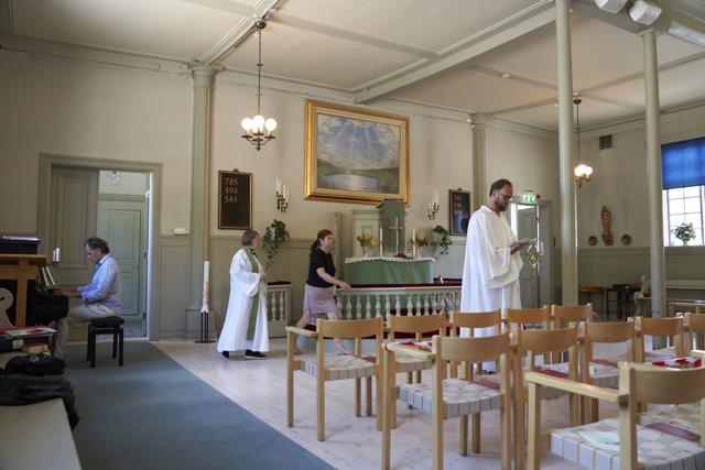 Rev. Elisabeth Oberg Hansen, centre left and church assistants prepare for a short service in Stockholm, Thursday, July 23, 2020. (AP) Rev. Elisabeth Oberg Hansen, centre left and church assistants prepare for a short service in Stockholm, Thursday, July 23, 2020. (AP)