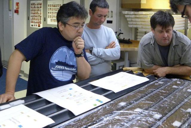 Researchers Yuki Morono, Laurent Toffin and Steven DÕHondt (L-R) work aboard the research drillship JOIDES Resolution with sediment cores gathered from deep beneath the seafloor under the Pacific Ocean in this undated photograph released on July 28, 2020. (Courtesy of IODP JRSO/Handout via REUTERS) Researchers Yuki Morono, Laurent Toffin and Steven DÕHondt (L-R) work aboard the research drillship JOIDES Resolution with sediment cores gathered from deep beneath the seafloor under the Pacific Ocean in this undated photograph released on July 28, 2020. (Courtesy of IODP JRSO/Handout via REUTERS)