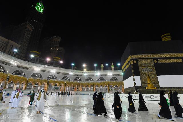 In this photo released by the Saudi Media Ministry, officials prepare for the arrival of pilgrims Wednesday, July 29, 2020, in Mecca, Saudi Arabia, by simulating the first rites of hajj around Islam’s holiest site, the Kaaba, hours before the pilgrimage is set to begin. The Islamic pilgrimage has been drastically downsized from 2.5 million pilgrims to as little as 1,000 this year due to the global coronavirus pandemic. pilgrimage has been dramatically downsized. (AP) In this photo released by the Saudi Media Ministry, officials prepare for the arrival of pilgrims Wednesday, July 29, 2020, in Mecca, Saudi Arabia, by simulating the first rites of hajj around Islam’s holiest site, the Kaaba, hours before the pilgrimage is set to begin. The Islamic pilgrimage has been drastically downsized from 2.5 million pilgrims to as little as 1,000 this year due to the global coronavirus pandemic. pilgrimage has been dramatically downsized. (AP)