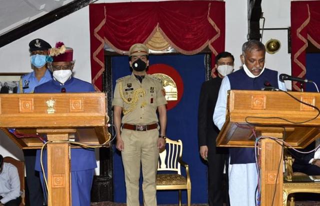 Paonta Sahib BJP MLA Sukhram Chaudhary (right) taking oath as minister. (HT Photo) Paonta Sahib BJP MLA Sukhram Chaudhary (right) taking oath as minister. (HT Photo)