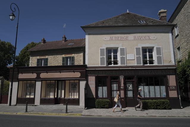 Visitors walk in front of the Auberge Ravoux where Dutch master Vincent van Gogh spent the last weeks of his life and completed dozens of paintings, in the village of Auvers-sur-Oise, 35 kilometers (21 miles) north of Paris. (AP Photo/Francois Mori) Visitors walk in front of the Auberge Ravoux where Dutch master Vincent van Gogh spent the last weeks of his life and completed dozens of paintings, in the village of Auvers-sur-Oise, 35 kilometers (21 miles) north of Paris. (AP Photo/Francois Mori)