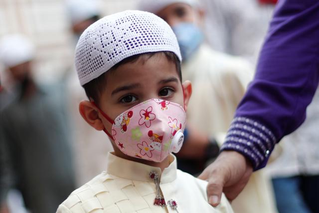 A Muslim boy wearing face mask leaves the Jama Masjid (Grand Mosque) after Eid al-Adha prayers during the outbreak of the coronavirus disease (COVID-19), in the old quarters of Delhi, India, August 1, 2020. (REUTERS) A Muslim boy wearing face mask leaves the Jama Masjid (Grand Mosque) after Eid al-Adha prayers during the outbreak of the coronavirus disease (COVID-19), in the old quarters of Delhi, India, August 1, 2020. (REUTERS)