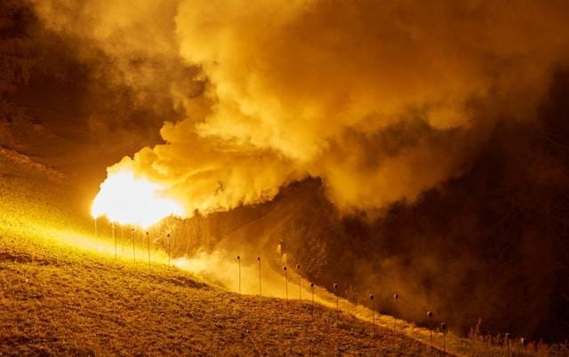 Flares of magnesium powder are pictured during the illumination of the mountain chains of Veisivi and Dent de Perroc to celebrate Swiss National Day following the coronavirus disease (COVID-19) outbreak in Evolene in the Val d'Herens, Switzerland July 31, 2020. (REUTERS/Denis Balibouse) Flares of magnesium powder are pictured during the illumination of the mountain chains of Veisivi and Dent de Perroc to celebrate Swiss National Day following the coronavirus disease (COVID-19) outbreak in Evolene in the Val d'Herens, Switzerland July 31, 2020. (REUTERS/Denis Balibouse)