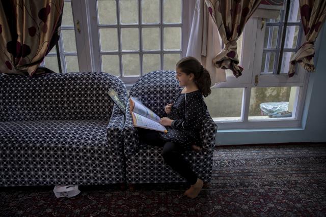 Jannat Tariq, 9, attends online classes inside her home in Srinagar, Indian controlled Kashmir, Wednesday, July 22, 2020. Children in this region are no strangers to lockdowns. Curfews, strikes and school shutdowns are all part of growing up in one of the world’s most militarized zones. So when schools in the disputed region reopened in late February, after six months of a strict lockdown that began in August 2019, Tariq was overjoyed to see her friends and teachers. But schools shut again the following month because of the coronavirus pandemic. (AP) Jannat Tariq, 9, attends online classes inside her home in Srinagar, Indian controlled Kashmir, Wednesday, July 22, 2020. Children in this region are no strangers to lockdowns. Curfews, strikes and school shutdowns are all part of growing up in one of the world’s most militarized zones. So when schools in the disputed region reopened in late February, after six months of a strict lockdown that began in August 2019, Tariq was overjoyed to see her friends and teachers. But schools shut again the following month because of the coronavirus pandemic. (AP)