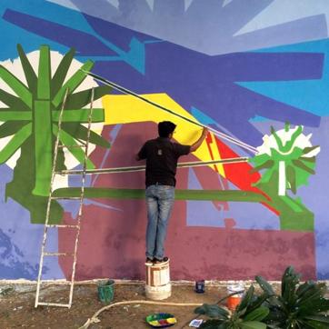 An artist working on a wall mural. (Photo: Instagram/delhistreetart) An artist working on a wall mural. (Photo: Instagram/delhistreetart)