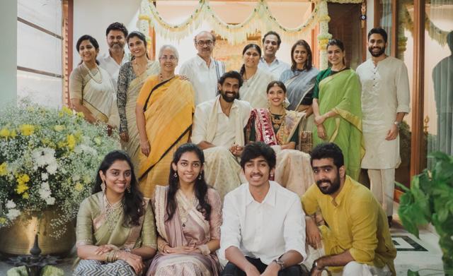 The newlyweds pose for a family picture. The newlyweds pose for a family picture.