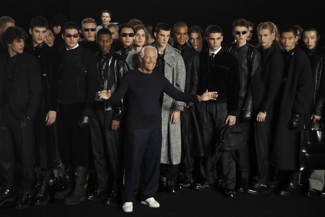 In this Saturday, Jan.11, 2019 file photo, designer Giorgio Armani, center, accepts applause at the conclusion of the Emporio Armani men's Fall-Winter 2020/21 collection, that was presented in Milan, Italy. (AP Photo/Luca Bruno, File) In this Saturday, Jan.11, 2019 file photo, designer Giorgio Armani, center, accepts applause at the conclusion of the Emporio Armani men's Fall-Winter 2020/21 collection, that was presented in Milan, Italy. (AP Photo/Luca Bruno, File)