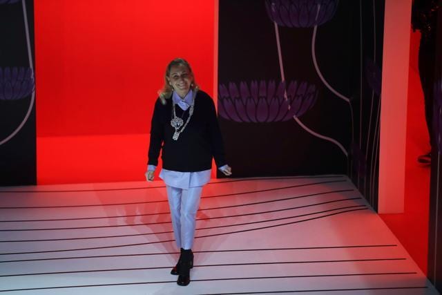 In this Thursday, Feb. 20, 2020 file photo, Miuccia Prada acknowledges the applauses at the end of her Prada women's Fall-Winter 2020-2021 fashion show, that was presented in Milan, Italy. (AP Photo/Luca Bruno, File) In this Thursday, Feb. 20, 2020 file photo, Miuccia Prada acknowledges the applauses at the end of her Prada women's Fall-Winter 2020-2021 fashion show, that was presented in Milan, Italy. (AP Photo/Luca Bruno, File)