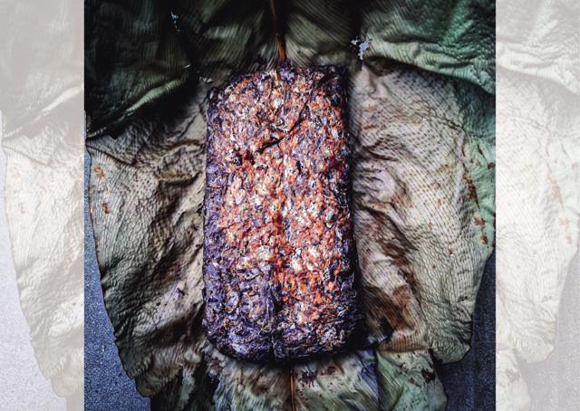 Small batches of akhuni are wrapped in banana leaves and smoked Small batches of akhuni are wrapped in banana leaves and smoked