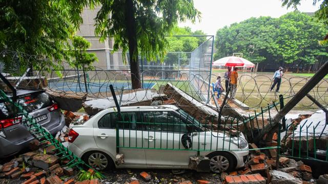 Car under the rubbles of Apeejay School’s boundary wall after it collapsed due to heavy rain in Saket, New Delhi. (Amal KS/HT PHOTO) Car under the rubbles of Apeejay School’s boundary wall after it collapsed due to heavy rain in Saket, New Delhi. (Amal KS/HT PHOTO)