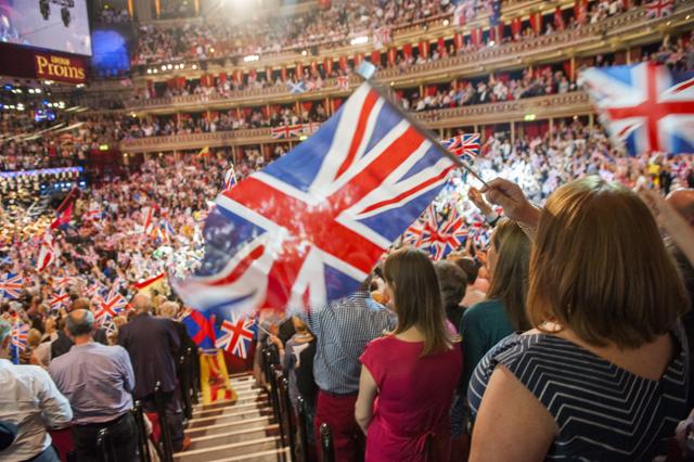 FILE - In this Sept. 13, 2014 file photo, members of the audience react during the Last Night of the Proms at the Royal Albert Hall, London. The BBC has ditched the lyrics of “Rule Britannia!” for its traditional summer-ending concert amid a controversy over the song’s celebration of the British Empire at a time when critics are re-evaluating the nation’s colonial past. Britain’s publicly funded broadcaster said the final night of its Proms concert series would feature instrumental versions of “Rule Britannia!” and “Land of Hope and Glory,” instead of traditional singalongs. (AP) FILE - In this Sept. 13, 2014 file photo, members of the audience react during the Last Night of the Proms at the Royal Albert Hall, London. The BBC has ditched the lyrics of “Rule Britannia!” for its traditional summer-ending concert amid a controversy over the song’s celebration of the British Empire at a time when critics are re-evaluating the nation’s colonial past. Britain’s publicly funded broadcaster said the final night of its Proms concert series would feature instrumental versions of “Rule Britannia!” and “Land of Hope and Glory,” instead of traditional singalongs. (AP)