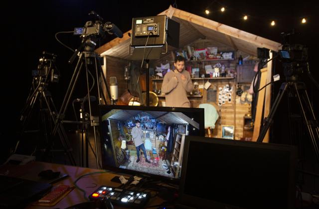 Performer Adam Kashmiry gets ready for his online performance at the Traverse theatre Edinburgh, Scotland, Friday Aug. 21, 2020. (AP)