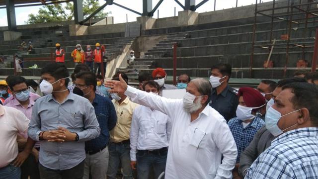Home minister Anil Vij inspecting the under-construction international level football stadium at the national war memorial stadium on NH-44 in Ambala Cantonment on Sunday. (HT PHOTO) Home minister Anil Vij inspecting the under-construction international level football stadium at the national war memorial stadium on NH-44 in Ambala Cantonment on Sunday. (HT PHOTO)