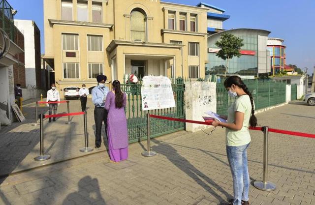Candidates maintaining social distancing while getting their documents checked in Ludhiana on Tuesday. (Gurpreet Singh/HT ) Candidates maintaining social distancing while getting their documents checked in Ludhiana on Tuesday. (Gurpreet Singh/HT )