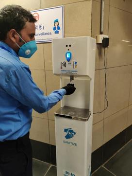 A thermal scanner cum sanitiser dispenser at the entry points at a metro stations. (Soumya Pillai/HT Photo )
