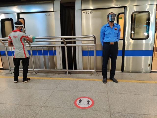 Delhi Metro staff seen wearing masks, gloves, and face shields. (Soumya Pillai/HT Photo )