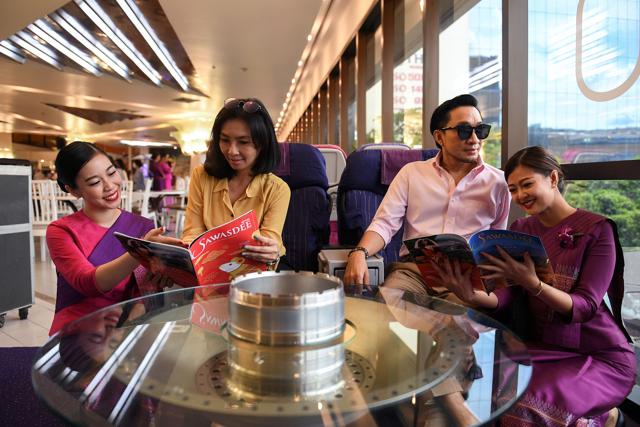 Customers sit in a first class raw set for taking pictures only inside a Thai Airways pop-up airplane-themed restaurant at the airlines headquarters with onboard meals prepared by their chefs, while their fleet is still grounded at the airport and the company awaits a bankruptcy court decision, in Bangkok, Thailand September 3, 2020. (REUTERS)
