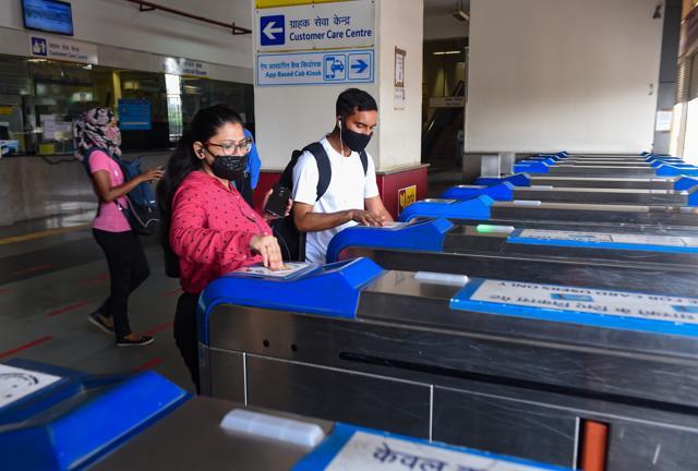 Commuters enter HUDA City Centre station. (PTI) Commuters enter HUDA City Centre station. (PTI)