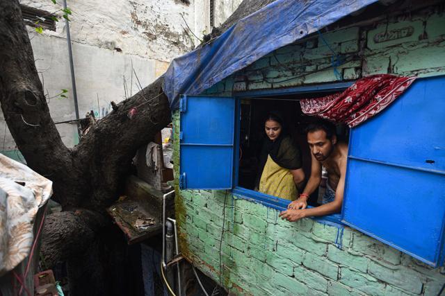 Residents look out from a home built near a large tree in the Chandni Chowk area in New Delhi on September 7, 2020. (Biplov Bhuyan/HT Photo) Residents look out from a home built near a large tree in the Chandni Chowk area in New Delhi on September 7, 2020. (Biplov Bhuyan/HT Photo)