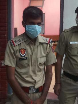 Rajvir Singh in police custody. Rajvir Singh in police custody.