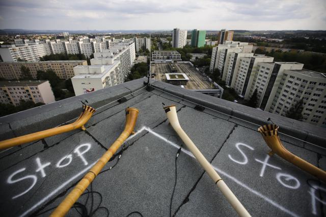 Four alphorns lie on the rooftop of a residence building. (AP) Four alphorns lie on the rooftop of a residence building. (AP)