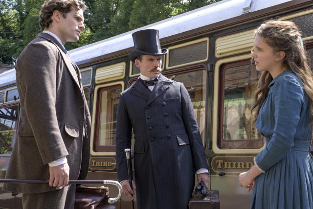 Henry Cavill as Sherlock Holmes, Sam Claflin as Mycroft and Millie Bobby Brown as Enola. ( ALEX BAILEY/LEGENDARY ©2020) Henry Cavill as Sherlock Holmes, Sam Claflin as Mycroft and Millie Bobby Brown as Enola. ( ALEX BAILEY/LEGENDARY ©2020)