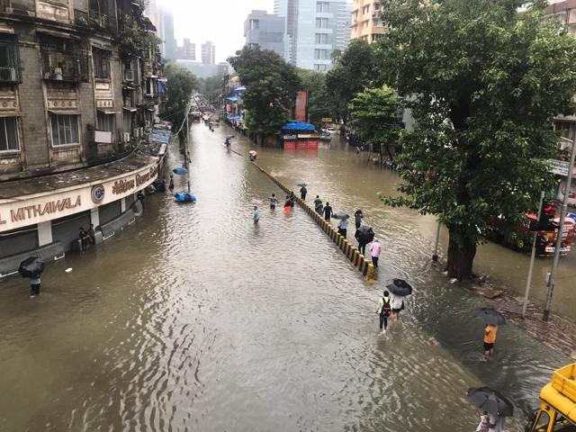 A waterlogged road in Parel, Mumbai. (Bhushan Koyande/HT Photo) A waterlogged road in Parel, Mumbai. (Bhushan Koyande/HT Photo)