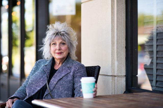 Joan Moore, 68, a retired housing advocate, sits for a photograph outside Phoenix Coffee in Cleveland Heights, Ohio, U.S., on Sunday, Sept. 20, 2020. (Bloomberg) Joan Moore, 68, a retired housing advocate, sits for a photograph outside Phoenix Coffee in Cleveland Heights, Ohio, U.S., on Sunday, Sept. 20, 2020. (Bloomberg)