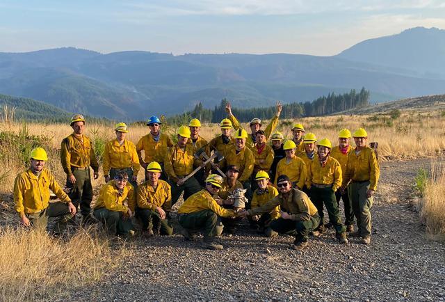 The Oregon Air National Guard pose for a group shot with Baby Yoda doll. (AP)