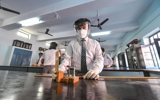 Lucknow: Students prepare to attend a class (PTI) Lucknow: Students prepare to attend a class (PTI)