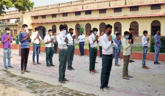 Students offer school prayer follwing safe distancing protocol as they arrive at school which reopened after COVID-19 lockdown (ANI) Students offer school prayer follwing safe distancing protocol as they arrive at school which reopened after COVID-19 lockdown (ANI)