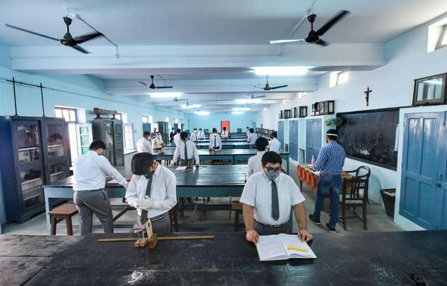 Lucknow: Students prepare to attend a class (PTI) Lucknow: Students prepare to attend a class (PTI)
