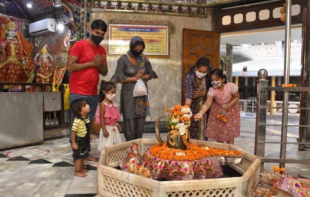 Residents paying obeisance at Krishna Temple in Ludhiana on Monday. (Harsimar Pal SIngh/HT)