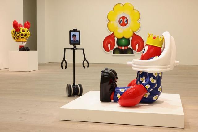 A man uses a robot to interactively engage with Philip Colbert's Lobsteropolis exhibition. (REUTERS) A man uses a robot to interactively engage with Philip Colbert's Lobsteropolis exhibition. (REUTERS)