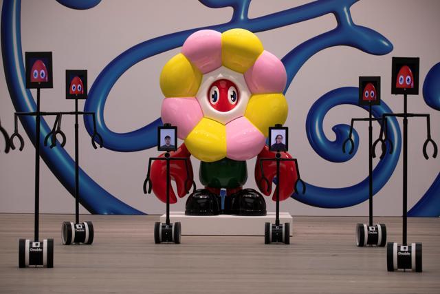 People use robots to interactively engage with Philip Colbert's Lobsteropolis exhibition. (REUTERS) People use robots to interactively engage with Philip Colbert's Lobsteropolis exhibition. (REUTERS)