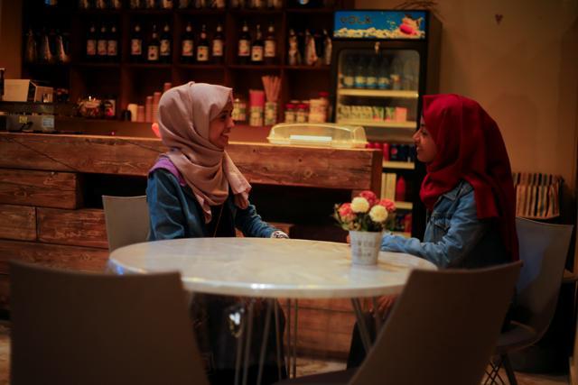 Women talk as they sit in the only all-female internet cafe in Marib, Yemen. (REUTERS) Women talk as they sit in the only all-female internet cafe in Marib, Yemen. (REUTERS)