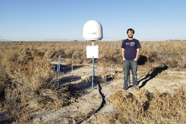 Radio astronomer Christopher Bochenek with a STARE2 station he developed near the town of Delta, Utah. (AP) Radio astronomer Christopher Bochenek with a STARE2 station he developed near the town of Delta, Utah. (AP)
